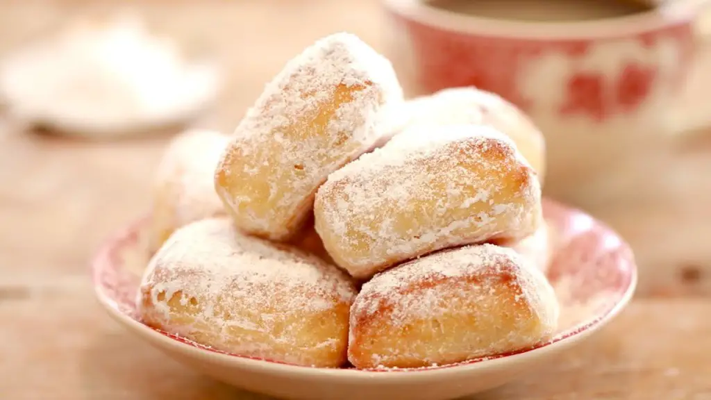 These Baked Homemade Beignets Covered With Powdered Sugar Are Sensational