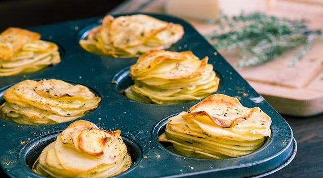 Parmesan potato stacks in a muffin tin