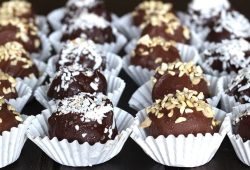 Chocolate-coated leftover cake truffles in paper cups