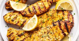 Juicy yogurt marinated chicken breasts with lemon, by Laney Schwartz