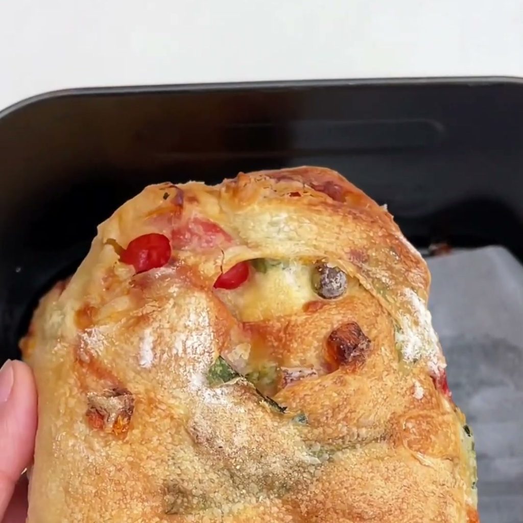 Golden air fryer ciabatta loaf filled with vegetables