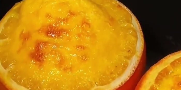 Orange pudding baked inside hollowed orange halves with a golden top