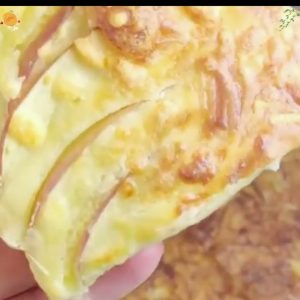 Golden air fryer apple cake with thin apple slices and a cheese crust