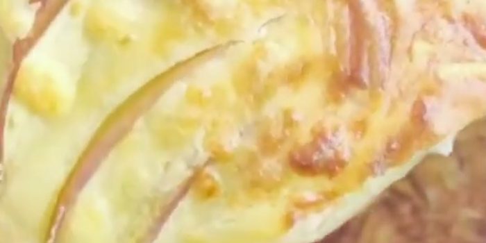 Golden air fryer apple cake with thin apple slices and a cheese crust