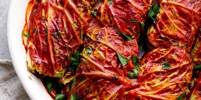 Cabbage rolls stuffed with wild rice and mushrooms in tomato sauce