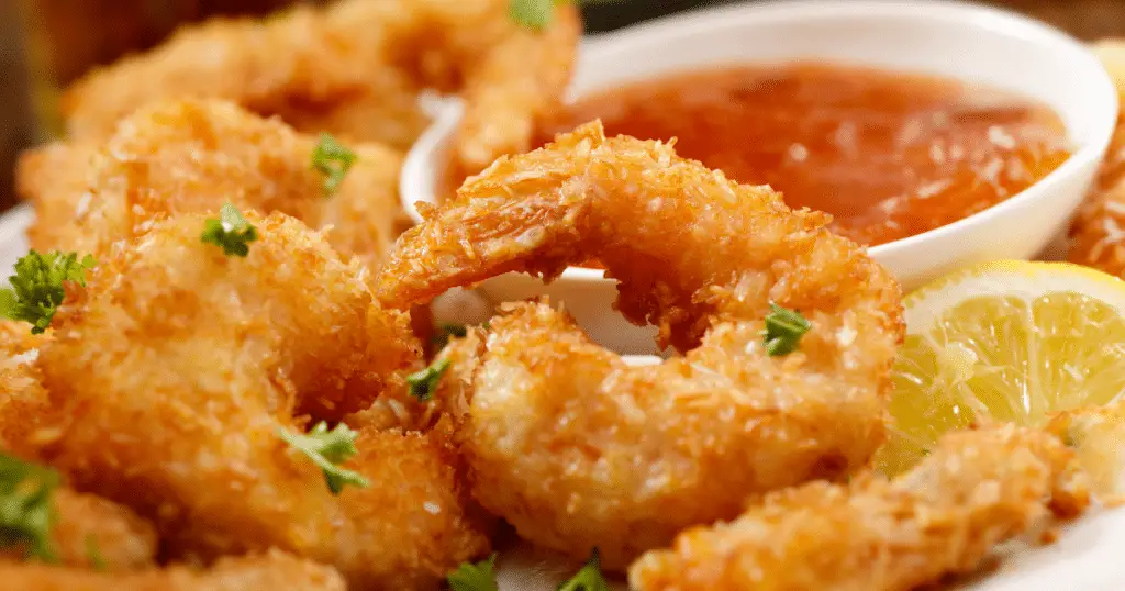 Coconut Jumbo shrimp with dipping sauce and a couple of beers.