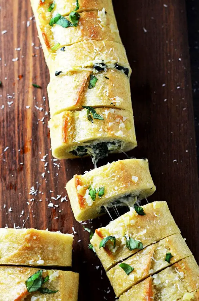 This image has an empty alt attribute; its file name is Spinach-and-Artichoke-Dip-Stuffed-Garlic-Bread20.jpg